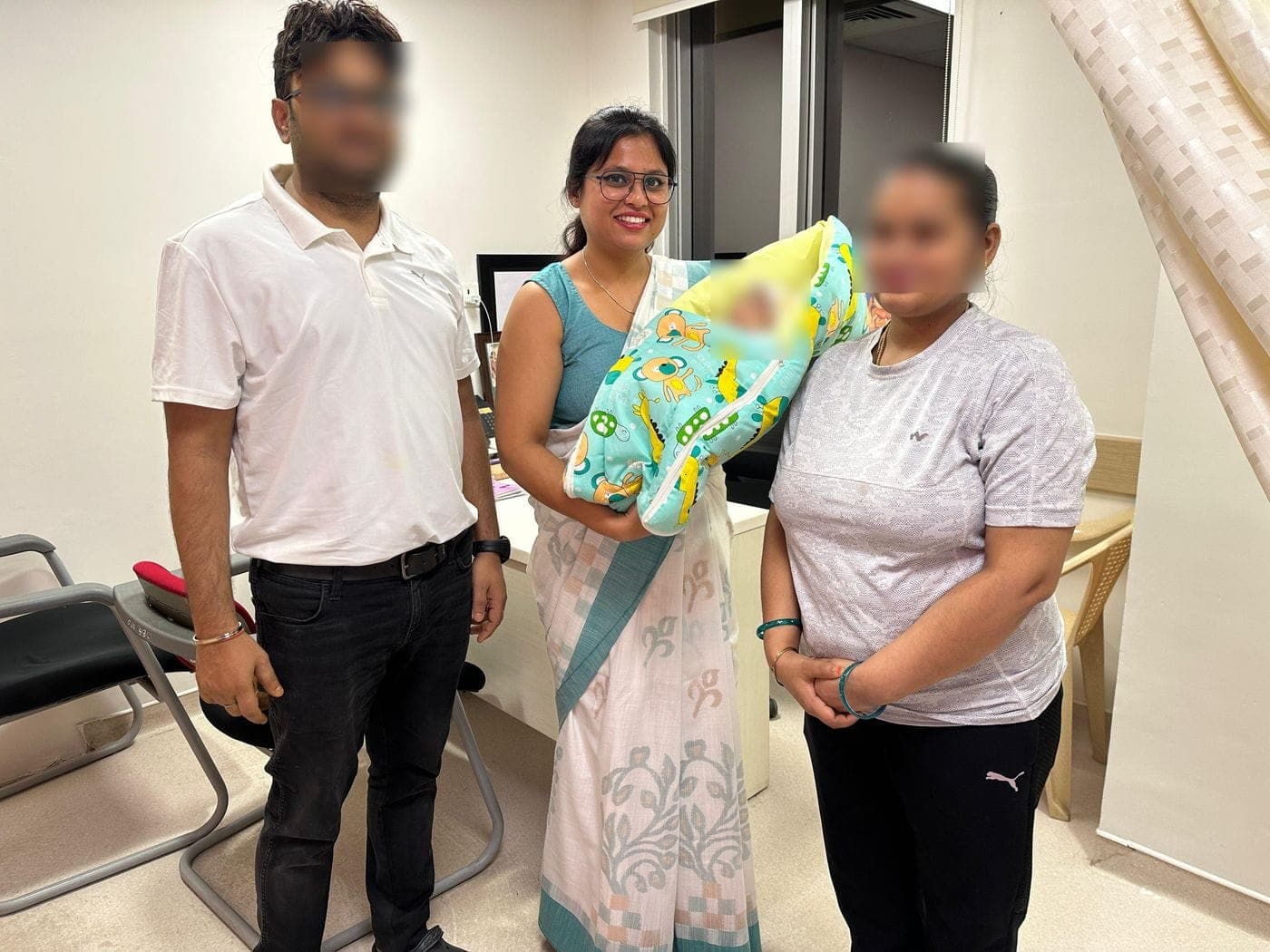 Dr. Nikita with a family and their newborn at the clinic