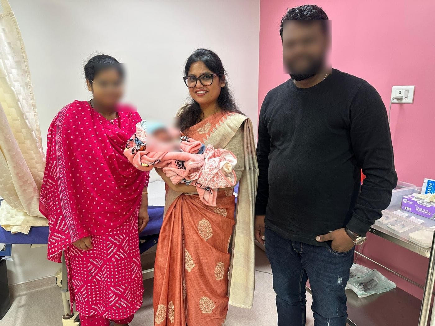 Dr. Nikita with a family after delivery