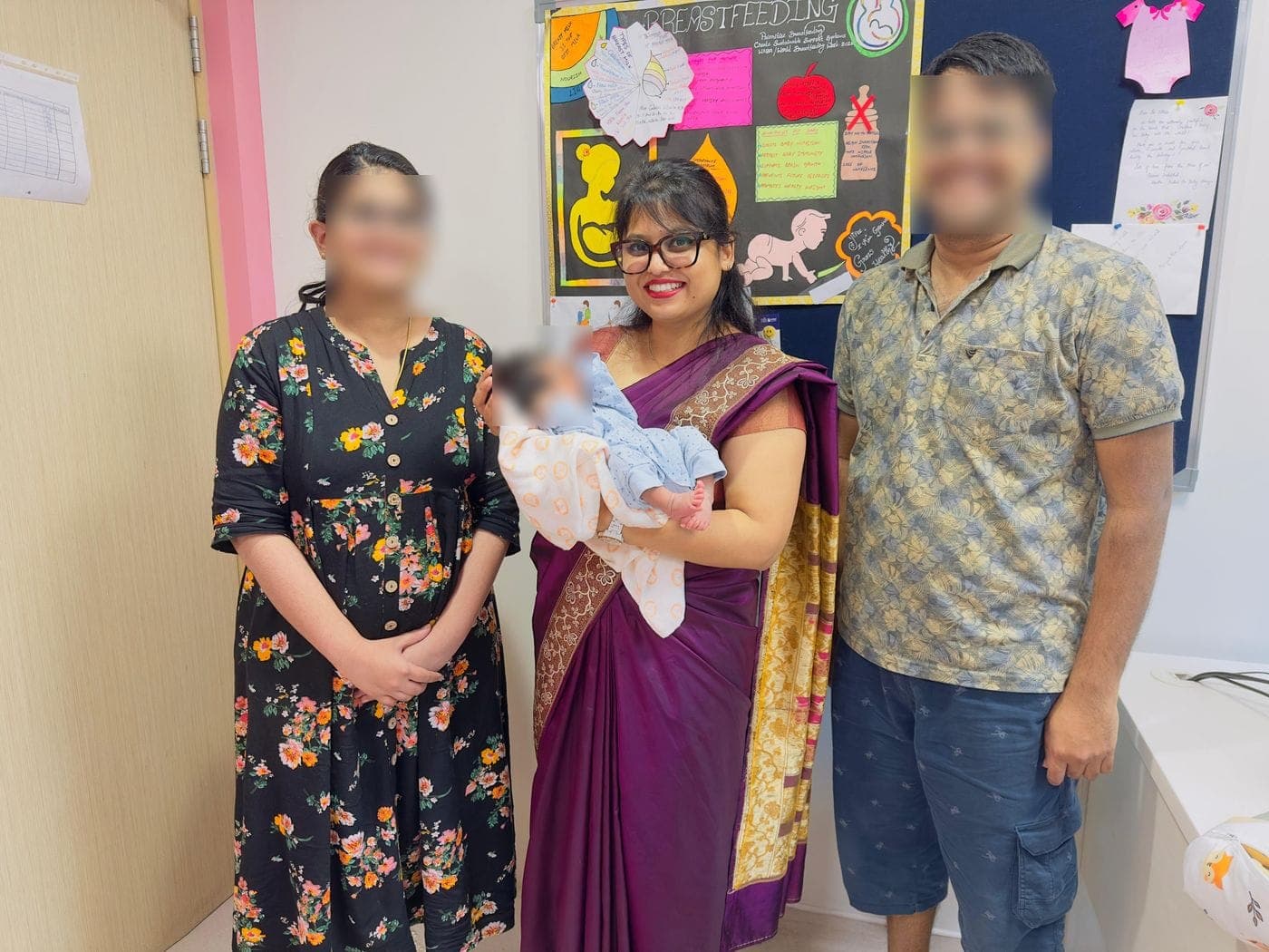 Dr. Nikita with parents and their newborn