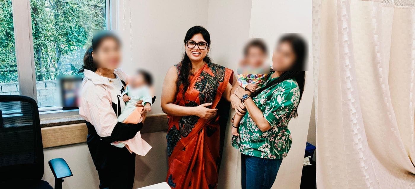 Dr. Nikita with families and their babies at the clinic