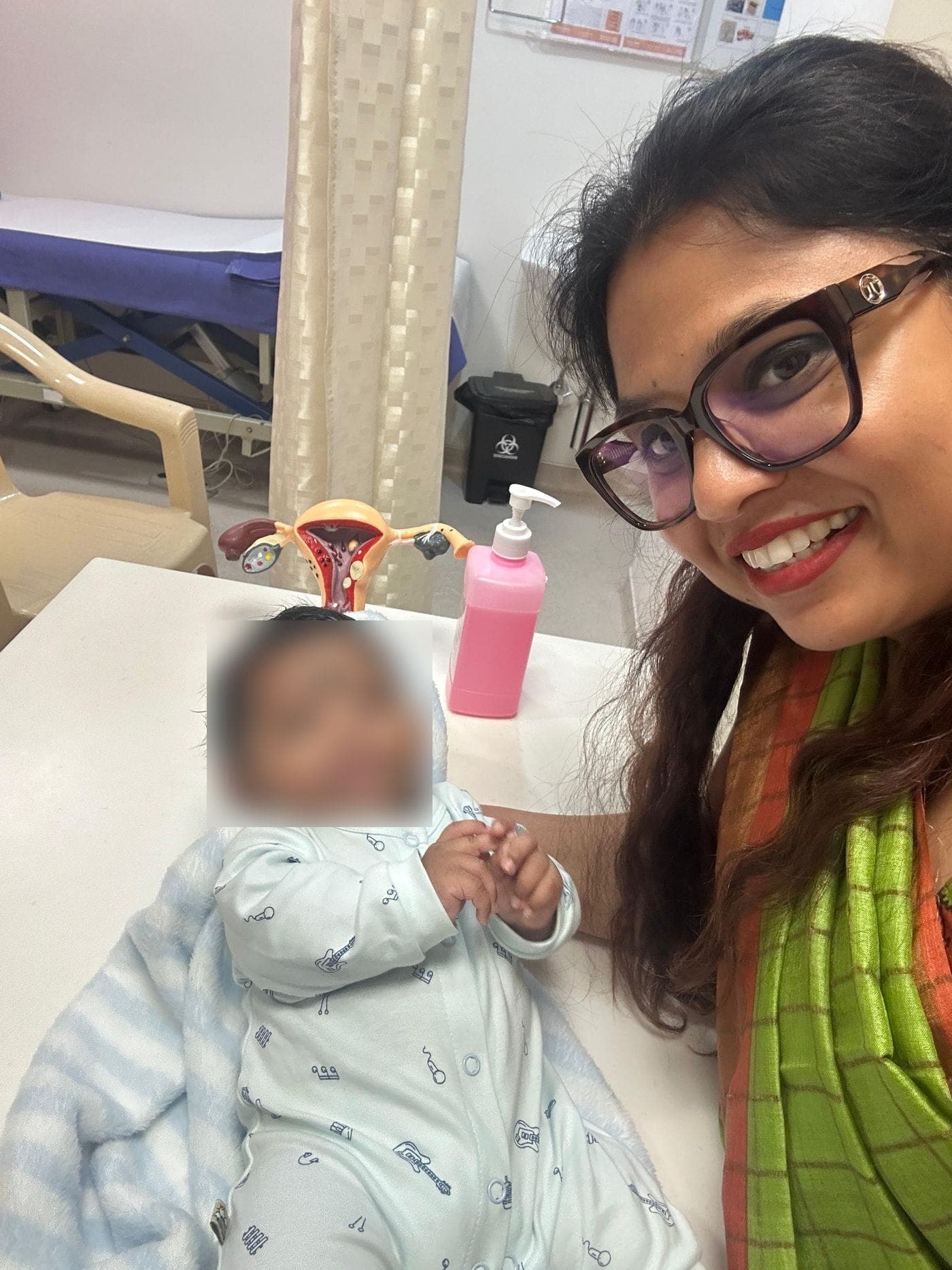 Dr. Nikita with a baby at a check-up