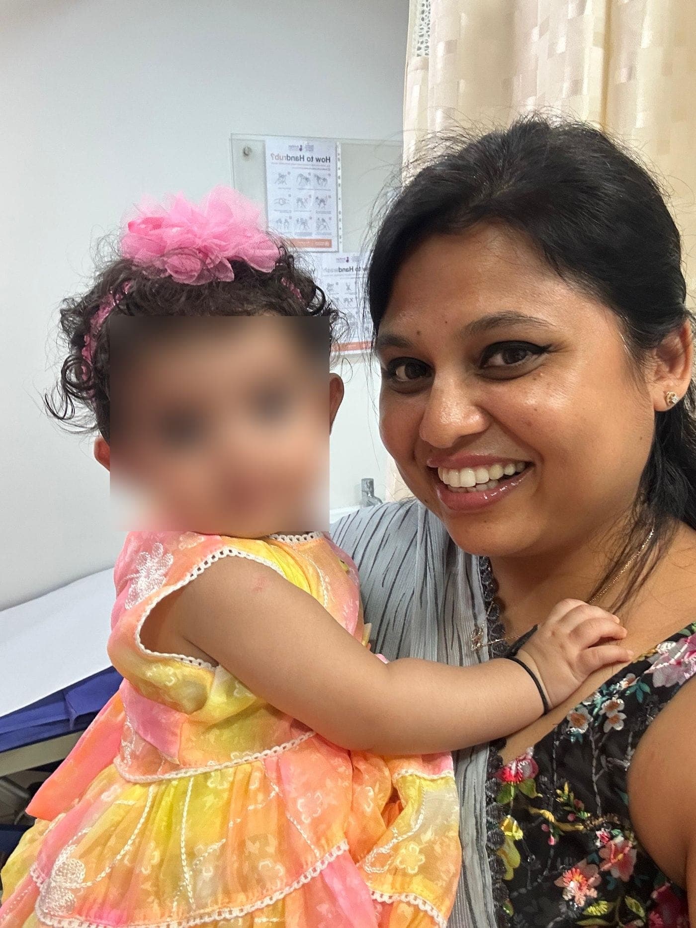 Dr. Nikita with a toddler at a follow-up visit